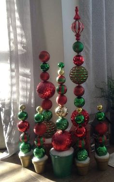 a small christmas tree made out of ornaments