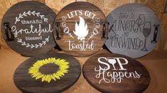 four wooden signs with different sayings on them