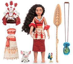 the doll is wearing a red and white dress with accessories around her neck, along with other items