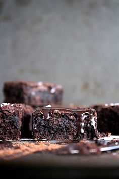 some brownies with chocolate icing on a plate