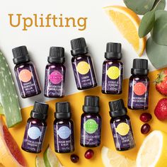 an assortment of essential oils sitting on top of fruit