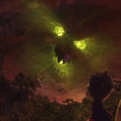 two children looking at an alien creature in the sky with green eyes and glowing lights