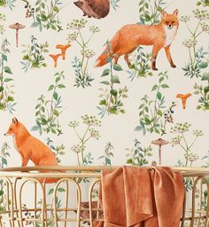 an animal themed wallpaper with foxes and other wild animals in the forest, on a baby's crib