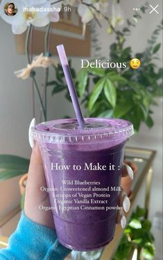 a person holding up a purple smoothie in front of a plant with the caption delicious how to make it?