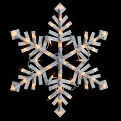 a white snowflake with lights on it