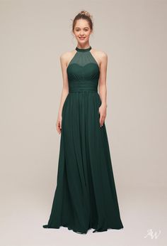 a woman in a long green dress with a halt neckline and pleaed skirt