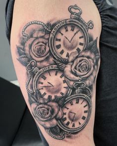 a woman's arm with roses and clocks on it