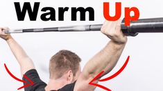 a man is lifting his arms with the words warm up above him