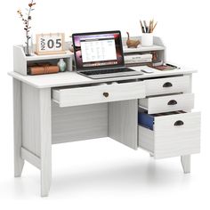 a laptop computer sitting on top of a wooden desk next to drawers and bookshelves