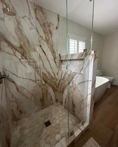 Practical luxury at its finest, porcelain slabs are the perfect addition to a shower!

Shower Walls: Magnifica Porcelain in Calacatta Antique

Designed by @edfinteriors Marble Slab Shower Walls, Slab Shower Walls, Bathrooms Design, Porcelain Bathroom, Bathroom Remodel Shower