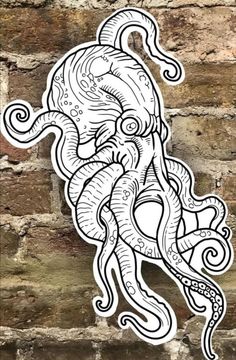 an octopus sticker on a brick wall