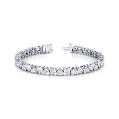 Heart shape diamond bracelet set in 18K white gold. 15.86 Total Carat Weight 38 Total Stones