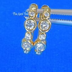 "Thank you for coming in! 14K solid gold rounded hoop earrings with bezel set sparkly diamond(0.15 carat, F/G color, SI clarity)! Stamped \"14k 0.15CT\"! You can wear them as they are or you can add your own dangles/charms! You'll get one pair per winning! SIZE: 11.5mmx12mm Weight: 1.8 gram (approx) MATERIAL: 14k Solid gold, Diamond" Bezel Set Diamond, Sky Blue Topaz, Dangle Charms, Wow Products, Solid Yellow, Bezel Setting, Spring Rings, Rose Cut, Blue Topaz