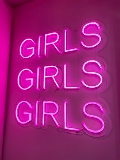 a neon sign that says girls, girls, girls on the side of a wall