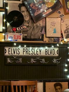 the elvis presley blvd sign is surrounded by pictures and memorabilia on display in this room