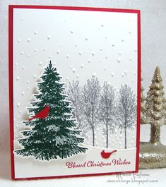 a card with a christmas tree and cardinal on it