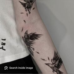 a person with a bird tattoo on their arm