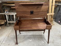 a wooden desk with an open drawer on it