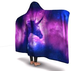 a hooded blanket with an image of a unicorn in the sky and stars on it