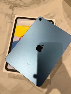 an apple ipad sitting on top of a table