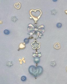 a key chain with charms and hearts on it