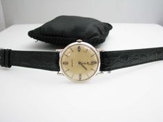 "For Sale: b332 Men's 14kt White Gold Mathey Tissot wristwatch Fair condition. Pre-owned. PLEASE READ ENTIRE DESCRIPTION BEFORE PURCHASING!! Nice men's Mathey Tissot watch. Item is in fair condition. Mechanical watch. The hands are silver in color. The crystal is in good shape, however, the dial has a blemish between the 3 & 4. Watch does run. Specifics: Mathey Tissot 14kt White Gold Mechanical Measurements: 33mm diameter with crown 7.10mm thick Band is 18mm wide ALL INCLUDED ITEMS ARE SHOWN Formal Round Analog Diamond Watch, Formal Yellow Gold Automatic Diamond Watch, Tissot Watches, Filigree Ring, Silver Chain Necklace, Saint Louis, Wristwatch Men, Wrist Watches, Mechanical Watch