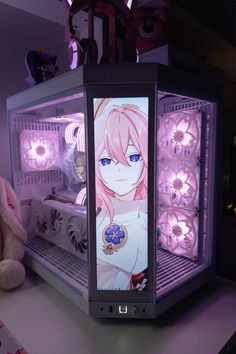 a pink - haired girl stands in front of a lit up display case on a table