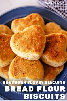 some biscuits on a blue plate with the words southern love biscuits bread flour biscuits