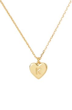 Personalize your everyday ensemble with a dainty chain necklace that suspends a heart-shaped pendant engraved with your initial. 17" length; 3" extender; 3/8"W x 3/8"L pendant Lobster clasp closure Goldtone plate Imported Gold K Necklace, Katespade Necklace, K Initial Necklace, K Necklace, Dainty Chain Necklace, Kate Spade Necklace, Dainty Chain, Heart Pendant Necklace, Initial Necklace