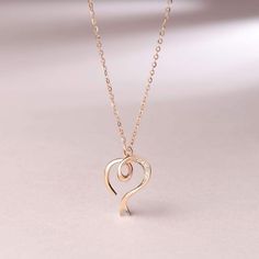 Love is Never Ending: Classic heart pendant design, the necklace is the best choice to show your love and gift for women and girls. Set a diamond in the middle of the heart pendant to look more luxurious. Wearing it, you will be the focus on any occasions. Materials: 14K Solid Rose Gold and Diamond. Pendant Size: 16*13MM. Chain Length: 16"+2" Extender for Adjusting. Weight: Total 1.68g. Gold And Diamond Pendant, Dainty Pendant Necklace, Dainty Pendant, Necklace Online, Pendant Design, Rose Gold Necklace, Rose Gold Diamonds, Diamond Heart, Gift For Women