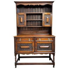 an old fashioned wooden cabinet with drawers