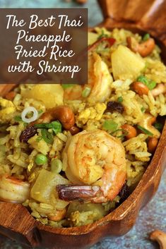 a wooden bowl filled with rice and shrimp