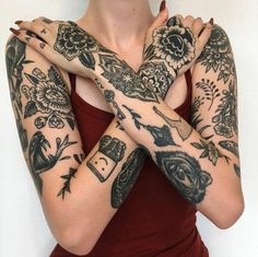 a woman with many tattoos on her arms