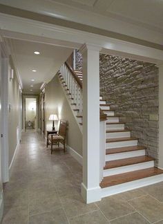 an empty entry way with stairs leading up to the second floor