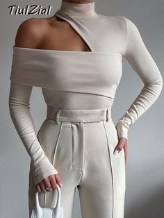 TiulZial Ribbed Knitted Turtleneck Long Sleeve Top Hollow Out White Sexy Club T Shirt Women Slim Skinny Tee Lady Clothing 2021 High Stretch Party Tops, High Stretch Solid Color Tops For Party, White Solid Color Top For Party, Ribbed High Stretch Top For Night Out, Chic Stretch Knit Top In Solid Color, Ribbed Long Sleeve Party Top, Chic High Stretch Beige Tops, Stretch Ribbed Knit Top For Party, Chic Beige High Stretch Top