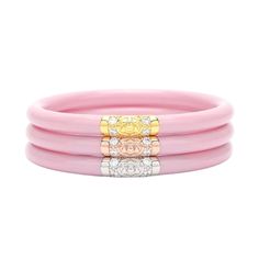 Like daughter, like mother. We know, this is backwards, but little girls did have them first. Now big girls can enjoy the beauty of our famous pink All Season Bangles. Sealed with our Three Kings bead, the set of three peony pink bangles is perfect for spring and summer and wonderful paired with gold, silver, or rose gold AWB®. Each set has our exclusive Lotus prayer bead in yellow gold, white gold, and rose gold…thus the name Three Kings, paying tribute to the three hues of gold. Please be awar Pink Bangles, Bangle Box, We Three Kings, Black Bangle, Gold Lotus, Dark Material, Tsa Approved, Serenity Prayer, Three Kings