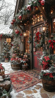 christmas decorations are on display in front of a house with red and green wreaths