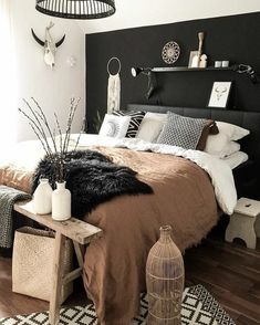 a black and white bedroom with an animal print rug