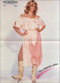 a woman in a pink dress and boots posing for a magazine cover with her legs crossed