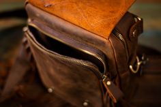 This unique bag, was handmade from my favorite quality, oil-tanned, crazy-horse leather, and lined with heavy canvas. This bag is durable and amazingly functional at the same time. The front flap and matching shoulder-piece were hand tooled and dyed. It features a large zippered front pocket, a zippered back pocket, and large main pouch with another small zippered pocket, and un-zippered small compartment. Bag dimensions: 8" W x 11"H x 4" D Strap is adjustable and is perfect for wearing cross-bo Compartment Bag, Shoulder Piece, Moon Bag, Bag Hanger, Floral Moon, Compact Bag, Bags Leather Handbags, Unique Purses, Purse Crossbody