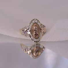 14k Oval Shaped Virgin Mary Ring / Blessed Mother Ring / Diamond Cut Religious Rings / Mother Mary Gold Ring / Gift For Her FEATURES @ Made to Order @ Materials: 14K  @ Avg Weight: 2.67g @ Gemstone: None @ Handmade in the USA SIZING If you need assistance with your ring size, just hit the "Message CherVenue" button and we will get back you within a few hours. RETURNS & EXCHANGES  I gladly accept returns, exchanges, and cancellations Contact me within: 7 days of delivery Ship items back within: 1 Gabi Demartino Wedding Ring, Princess Mary Ring, Luxury Vintage Rings For Memorial, Luxury Vintage Rings For Memorials, Vintage Gold Ring With Halo, Oval Ring With Hallmark For Anniversary, Rose Gold Oval Ring Stamped 14k, Oval Hallmarked Ring For Gift, Oval Hallmarked Ring As Gift