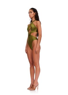 The NAYO one piece is that elegant swimsuit with cutouts that show just the right amount of skin. Its distinct twist detail highlights the midriff pleasantly concealing the sensitive areas. Its halter tie and W under provide adjustable bust support. 80% Nylon / 20% Spandex One piece swimsuit with cutouts Criss-cross halter neck tie Exposed W wire with moulded cups High-cut leg opening Twist detail at waist Open back with adjustable strap Hand wash cold, line dry Model (S) is 5'10 and wears a siz Elegant Swimsuit, Andrea Iyamah, High Cut, New Woman, Moda Operandi, Halter Neck, Fashion Collection, One Piece Swimsuit, Emerald