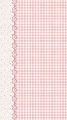 a pink and white checkered tablecloth with lace on the edge, as well as dots