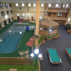 an indoor swimming pool in the middle of a building