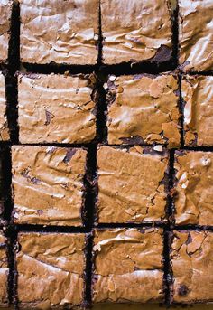 some brownies are cut into squares and placed on top of each other with icing