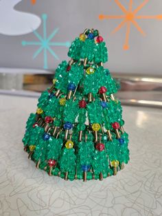 a christmas tree made out of plastic beads