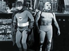 two men in costumes standing next to each other