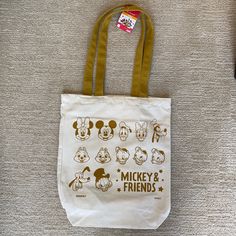 Bnwt Daiso X Disney Mickey Mouse And Friends Canvas Tote Bag In Natural/Mustard Yellow. This Can Be Your Next Everyday Tote Bag To Show Your Love For Disney. There Are Just Some Marks On The Bottom Of The Tote Bag But Should Come Off When You Hand Wash It. Material 70% Polyester 22% Cotton 7% Rayon & 1% Elastin/Polyurethane Size Length 13” X Height 15” Width 3.5” Disney Yellow Bags For Everyday Use, Disney Yellow School Bag, Yellow Disney School Bag, Mickey Mouse Tote Bags For Daily Use, White Mickey Mouse Bag For Disney Fan Events, White Mickey Mouse Bag For Daily Use, White Mickey Mouse Bags For Daily Use, Disney Tote Bag, Disney Tote Bags