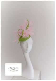 'Gorgeous elegance captures this truly striking but feminine piece in lime green sinamay with pink feather embellishments.  A soft feather flower  nestles amongst a feather tree of floating goose feathers, which twist and turn around curled lime green sinamay loops.  So elegant.  Sits on a headband.   ''This item has sold, however, similar pieces can be made in a variety of colours.  Please ask for details.  As every piece is handmade, some differences can occur from the photos listed on this si Whimsical Green Mini Hats For Parties, Adjustable Green Mini Hat For Wedding, Green Mini Hat For Royal Ascot, Whimsical Green Mini Hat For Spring, Green Whimsical Mini Hat For Spring, Green Hat Fascinator For Royal Ascot, Green Fitted Fascinator For Races, Fitted Green Fascinator For Races, Green Headpiece For Wedding And Kentucky Derby