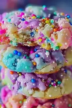 a stack of colorful cookies with sprinkles on them